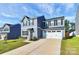 Two-story house with gray siding, black shutters, and a two-car garage at 153 Crownpiece St, Troutman, NC 28166