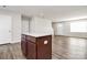 Modern kitchen island with granite countertops and dark wood cabinets at 153 Crownpiece St, Troutman, NC 28166