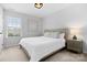 Bright bedroom with a queen-size bed and neutral decor at 17527 Austins Creek Dr, Charlotte, NC 28278