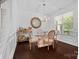 Formal dining room with glass table and chandelier at 17527 Austins Creek Dr, Charlotte, NC 28278