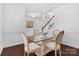 Formal dining room with glass table and chandelier at 17527 Austins Creek Dr, Charlotte, NC 28278