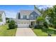 Two-story house with gray siding, white trim, and a two-car garage at 17527 Austins Creek Dr, Charlotte, NC 28278