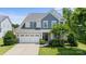 Two-story house with gray siding, white trim, and a two-car garage at 17527 Austins Creek Dr, Charlotte, NC 28278