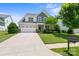 Two-story house with gray siding, white trim, and a two-car garage at 17527 Austins Creek Dr, Charlotte, NC 28278