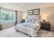 Main bedroom with a king-size bed and tufted headboard at 1804 Otter Perch Ln, Fort Mill, SC 29715