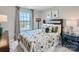 Charming bedroom with patterned bedding and natural light at 1804 Otter Perch Ln, Fort Mill, SC 29715