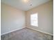 Simple bedroom with window and carpet at 18618 The Commons Blvd, Cornelius, NC 28031