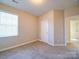 Bedroom with window, closet, and carpet at 18618 The Commons Blvd, Cornelius, NC 28031