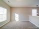 Bright dining room with neutral wall colors and carpet flooring at 18618 The Commons Blvd, Cornelius, NC 28031