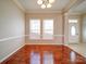 Dining room with hardwood floors, crown molding, and natural light at 18618 The Commons Blvd, Cornelius, NC 28031