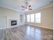 Living room features a fireplace, built-in shelving, and hardwood floors at 18618 The Commons Blvd, Cornelius, NC 28031