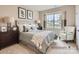 Bright bedroom with a queen-size bed, nightstand, and window at 1980 Copper Path Dr, Fort Mill, SC 29715