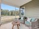 Relaxing screened porch with wicker furniture and wooded views at 1980 Copper Path Dr, Fort Mill, SC 29715