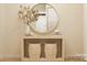 Light and airy entryway with console table and round mirror at 1984 Copper Path Dr, Fort Mill, SC 29715