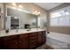 Double vanity bathroom with soaking tub and separate shower at 19914 Wooden Tee Dr, Davidson, NC 28036