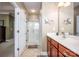 Bathroom with a walk-in shower and modern vanity at 19914 Wooden Tee Dr, Davidson, NC 28036