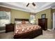 Bright bedroom featuring a king-size bed and built-in storage at 19914 Wooden Tee Dr, Davidson, NC 28036