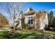 Gray two-story house with stone accents, and landscaped yard at 19914 Wooden Tee Dr, Davidson, NC 28036