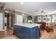 Large kitchen island with blue cabinetry and white countertops at 19914 Wooden Tee Dr, Davidson, NC 28036