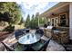 Outdoor kitchen and dining area on a flagstone patio at 19914 Wooden Tee Dr, Davidson, NC 28036