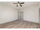 Spacious bedroom with wood-look flooring and ceiling fan at 207 Faulkner St, Clover, SC 29710