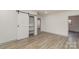 Bedroom with barn door, built-in shelving and hardwood floors at 207 Faulkner St, Clover, SC 29710