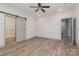 Bedroom with grey barn door, closet, and hardwood floors at 207 Faulkner St, Clover, SC 29710