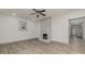 Living room featuring hardwood floors and a whitewashed brick fireplace at 207 Faulkner St, Clover, SC 29710