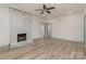 Living room with fireplace, hardwood floors, and ceiling fan at 207 Faulkner St, Clover, SC 29710