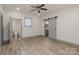 Main bedroom with grey barn door and en-suite bathroom at 207 Faulkner St, Clover, SC 29710