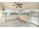 Bright sunroom featuring a ceiling fan and view of backyard at 207 Faulkner St, Clover, SC 29710