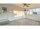 Bright sunroom with ceiling fan and access to backyard at 207 Faulkner St, Clover, SC 29710