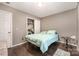 Cozy bedroom with double bed, closet, and wood flooring at 225 Mighty Joe Trl, York, SC 29745