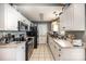 Galley-style kitchen with white cabinets and granite countertops at 225 Mighty Joe Trl, York, SC 29745