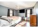 Main bedroom with hardwood floors, ceiling fan and large window at 225 Mighty Joe Trl, York, SC 29745