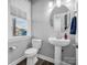 Stylish bathroom with pedestal sink, toilet and window at 228 Pinnacle Xing, Shelby, NC 28152