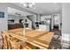 Bright dining room with wooden table and view into kitchen at 228 Pinnacle Xing, Shelby, NC 28152