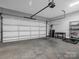 Spacious garage with storage shelving and a workbench at 228 Pinnacle Xing, Shelby, NC 28152