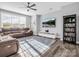 Living room with sectional sofa, built-in shelving and large TV at 228 Pinnacle Xing, Shelby, NC 28152