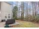 Private backyard with patio and wooded area at 2604 Cochrane Dr, Charlotte, NC 28269