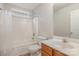 Bathroom with toilet, tub, and wood vanity at 2604 Cochrane Dr, Charlotte, NC 28269