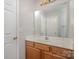 Clean bathroom with wood vanity and large mirror at 2604 Cochrane Dr, Charlotte, NC 28269