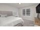 Well-lit bedroom with a comfortable bed and dresser at 2604 Cochrane Dr, Charlotte, NC 28269