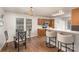 Kitchen features a dining area with glass table and chairs at 2604 Cochrane Dr, Charlotte, NC 28269