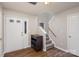 Inviting entryway with hardwood floors, staircase, and a dark brown console table at 2604 Cochrane Dr, Charlotte, NC 28269