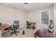 Home office with desk, chair, and ample natural light at 2604 Cochrane Dr, Charlotte, NC 28269