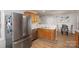 Kitchen boasts stainless steel fridge and oak cabinets at 2604 Cochrane Dr, Charlotte, NC 28269