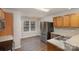 Stainless steel appliances and oak cabinets in this kitchen at 2604 Cochrane Dr, Charlotte, NC 28269