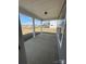 Covered back porch featuring concrete flooring and a white pillar design at 3240 Mcharney Dr # 36, Harrisburg, NC 28075