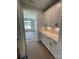 Hallway featuring white cabinets with granite countertops and an adjacent dining room at 3240 Mcharney Dr # 36, Harrisburg, NC 28075